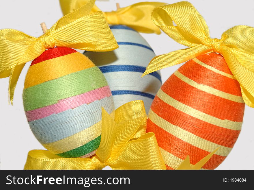 Colorful easter eggs with yellow bows