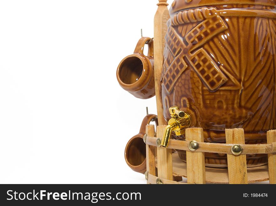 Glazed ceramic spirit cask with faucet and cup. Glazed ceramic spirit cask with faucet and cup