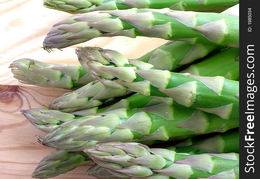 Green asparagus on the cutting board. Green asparagus on the cutting board