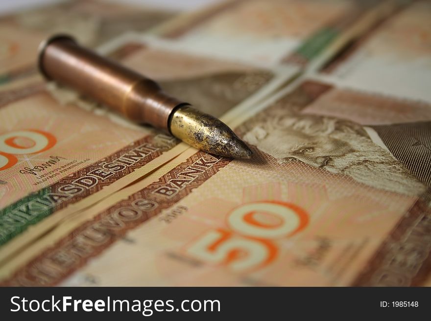 Bullet Placed On Money
