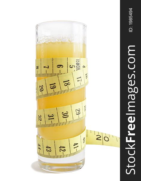 Glass of juice and measuring tape. Glass of juice and measuring tape