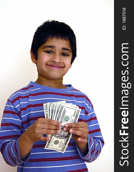 A kid very happy with money in his hands. A kid very happy with money in his hands