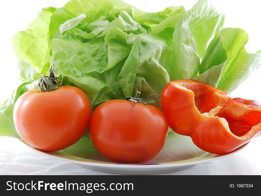 Fresh vegetables against white background