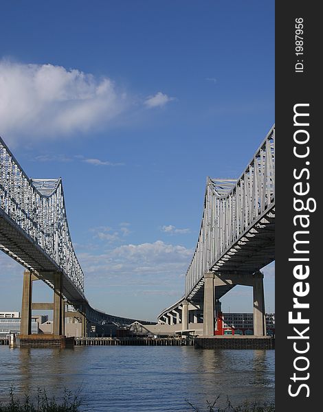 Vertical image of the Crescent City Connection bridges in New Orleans as they cross the port.