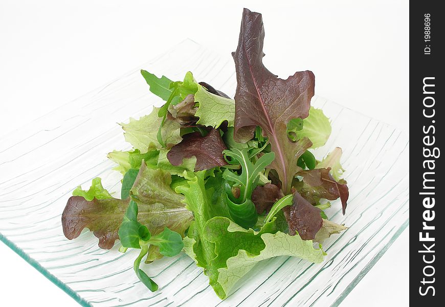 Green salad on a glass plate