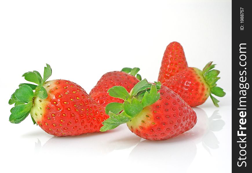 Strawberries on a gleamy surface. Strawberries on a gleamy surface