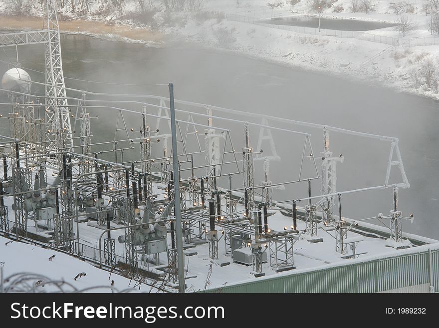 Power plant below the dam on the river. Power plant below the dam on the river.