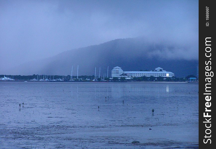 The harbor of Cairns is difficult to see, cause of the misty rain clouds. The harbor of Cairns is difficult to see, cause of the misty rain clouds