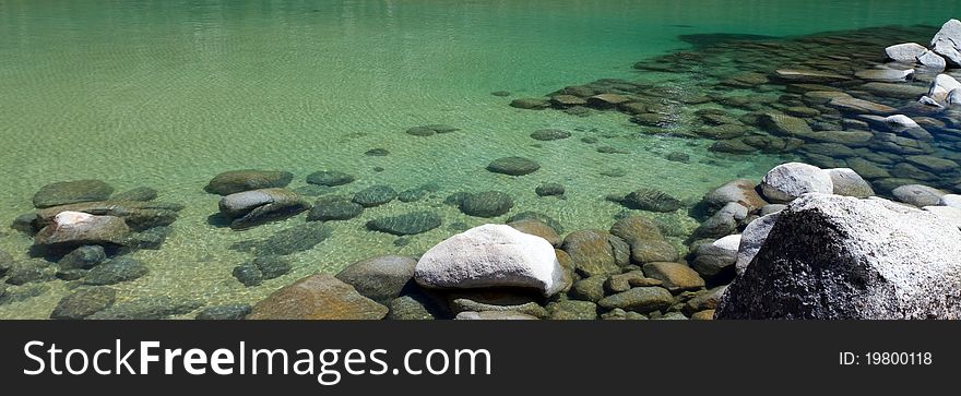 Panorama of shallow clear Lake Tahoe water