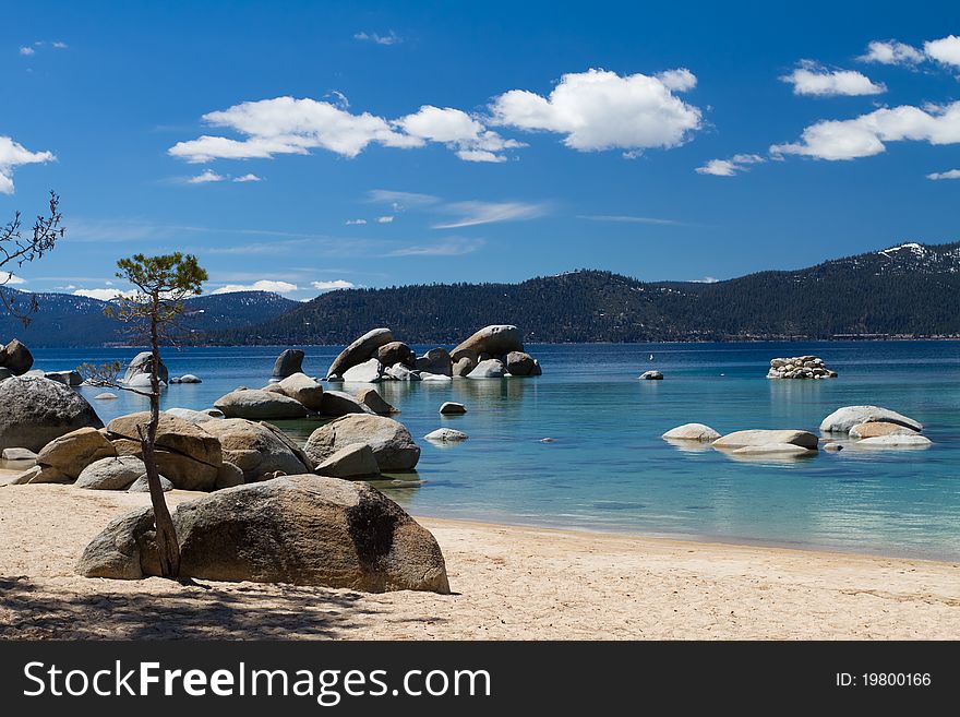 Lake Tahoe beach with few clouds