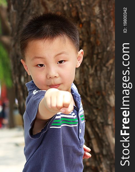 The portrait of an Asian boy who is doing exercises. The portrait of an Asian boy who is doing exercises.