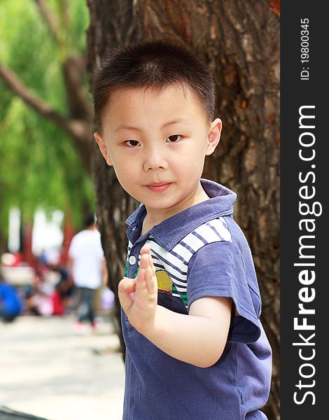 The portrait of an Asian boy who is doing exercises. The portrait of an Asian boy who is doing exercises.