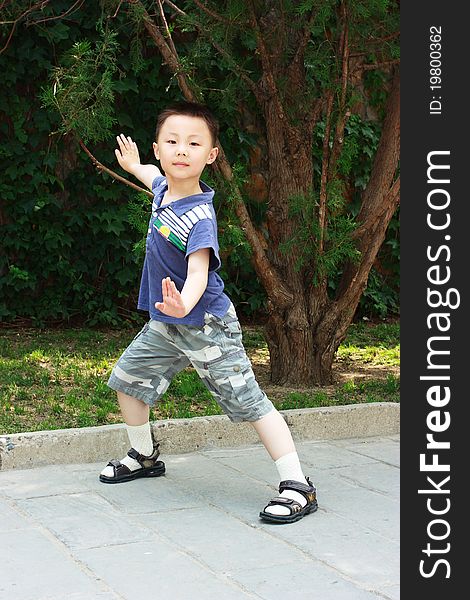 The portrait of an Asian boy who is doing exercises. The portrait of an Asian boy who is doing exercises.