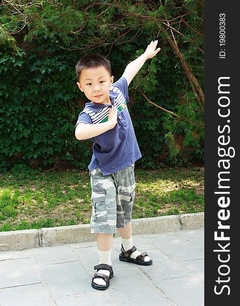 The portrait of an Asian boy who is doing exercises. The portrait of an Asian boy who is doing exercises.