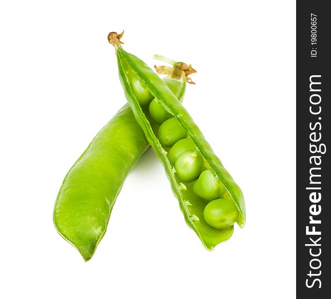 Ripe green peas in the shell on a white background