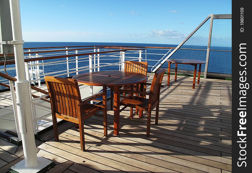 Cruise ship deck with table and chairs