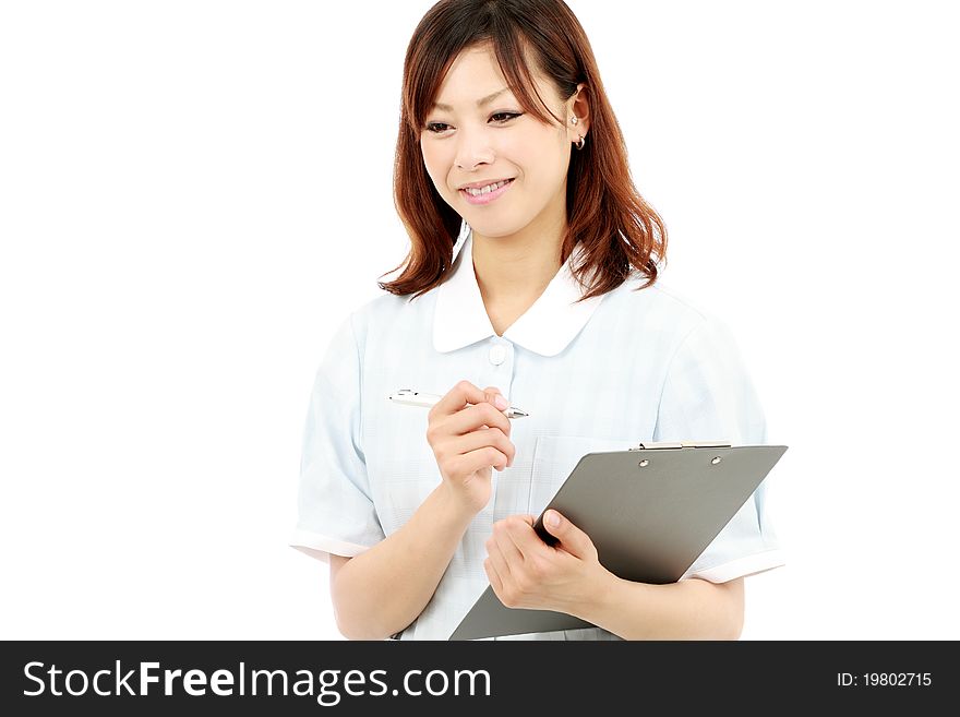 Young asian female nurse in uniform, holding a cli