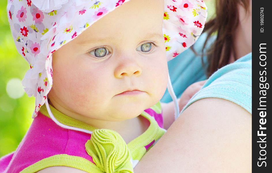 Baby girl isolated on green