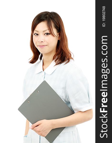 Young asian female nurse holding a clipboard