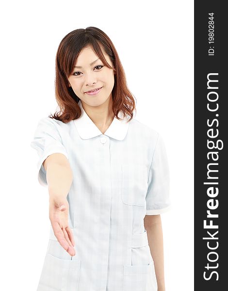 Young japan pretty smiling nurse giving her hand. Young japan pretty smiling nurse giving her hand