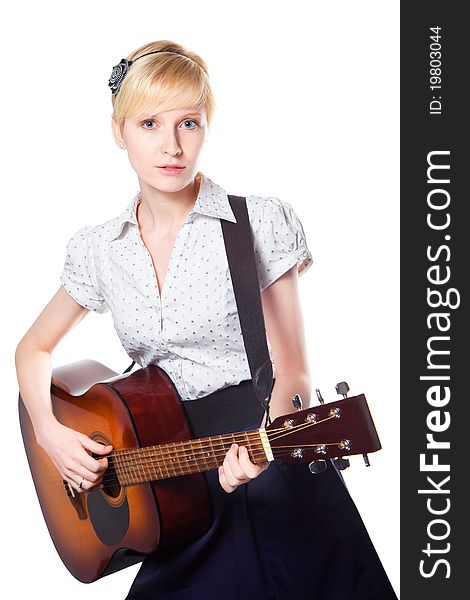 Attractive blond young woman playing guitar on isolated white background