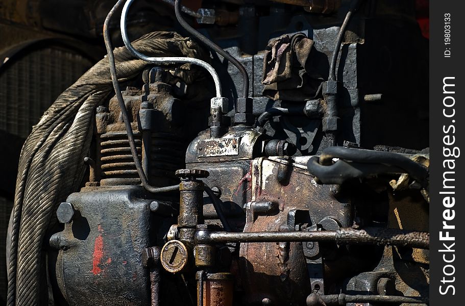 Old rusty engione of a bulldozer. Old rusty engione of a bulldozer