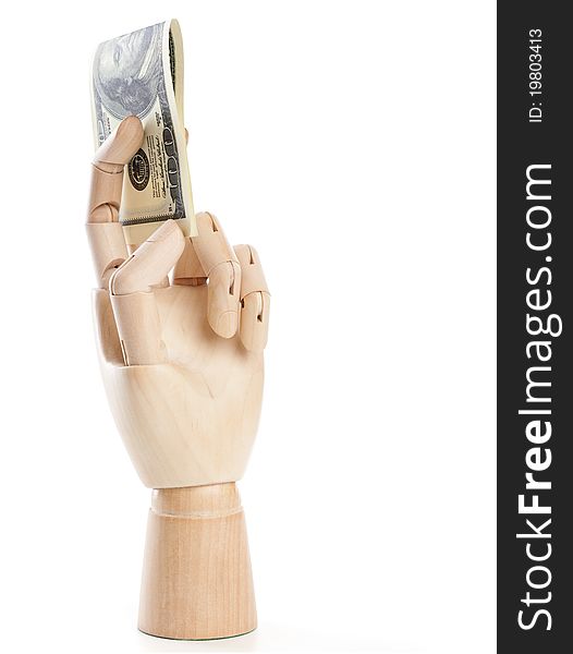 A wooden hand with dollars. Isolated on a white background