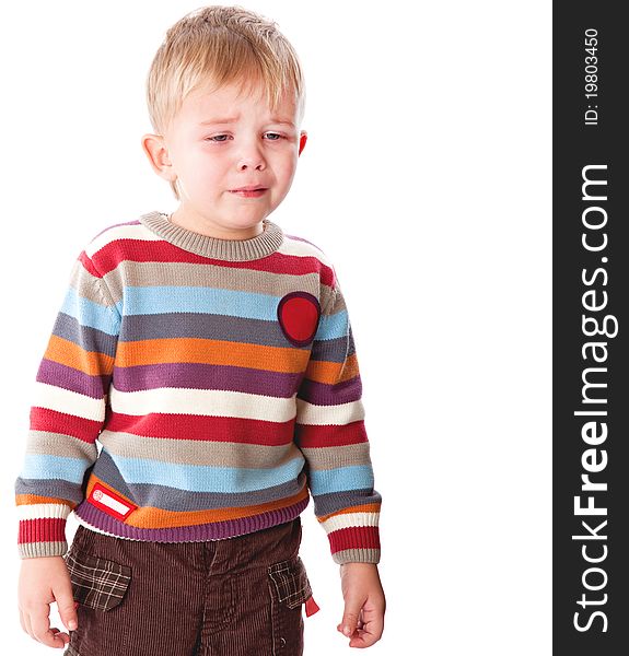 A crying boy. Isolated on a white background