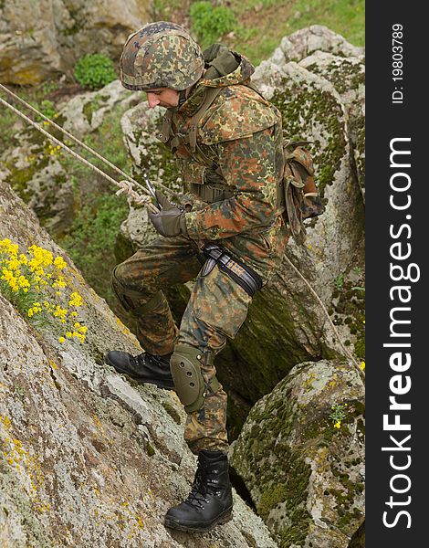 Soldier Climbing Down The Mountain