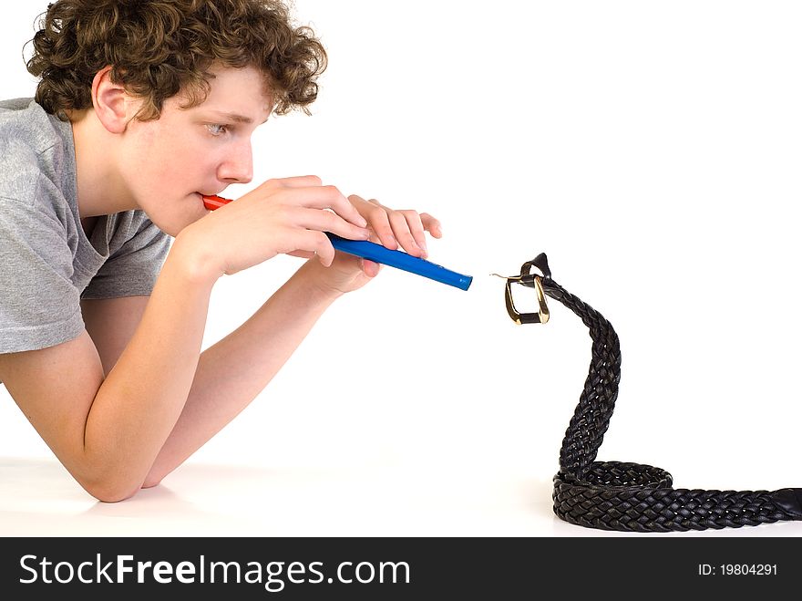 Boy with fife in front of leather belt in the form of a cobra. Boy with fife in front of leather belt in the form of a cobra