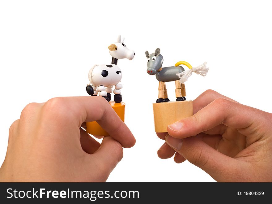 Toy cow in hand isolated on white background. Toy cow in hand isolated on white background