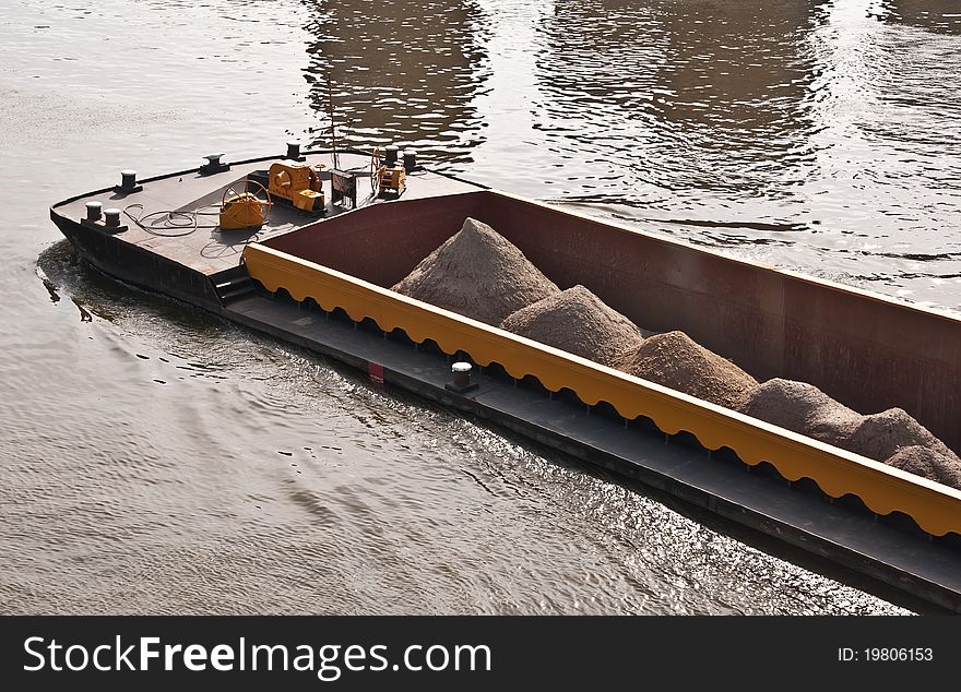 River cargo ship transporting gravel and sand. River cargo ship transporting gravel and sand