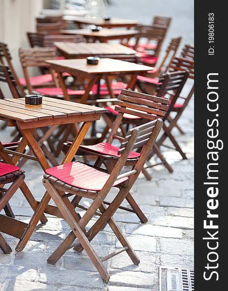 Empty tables in street cafe