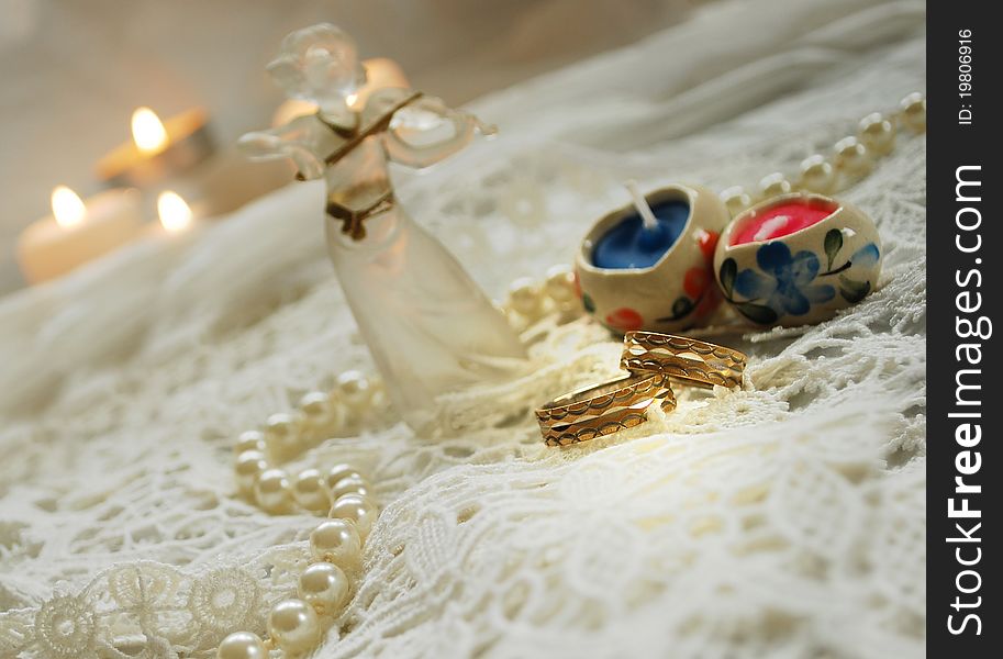 Wedding bands on white lace/invitation. Wedding bands on white lace/invitation