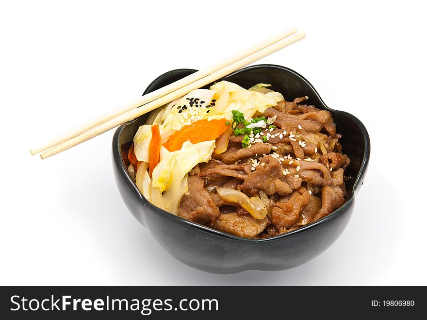 Rice under fried pork and vegetable on white background