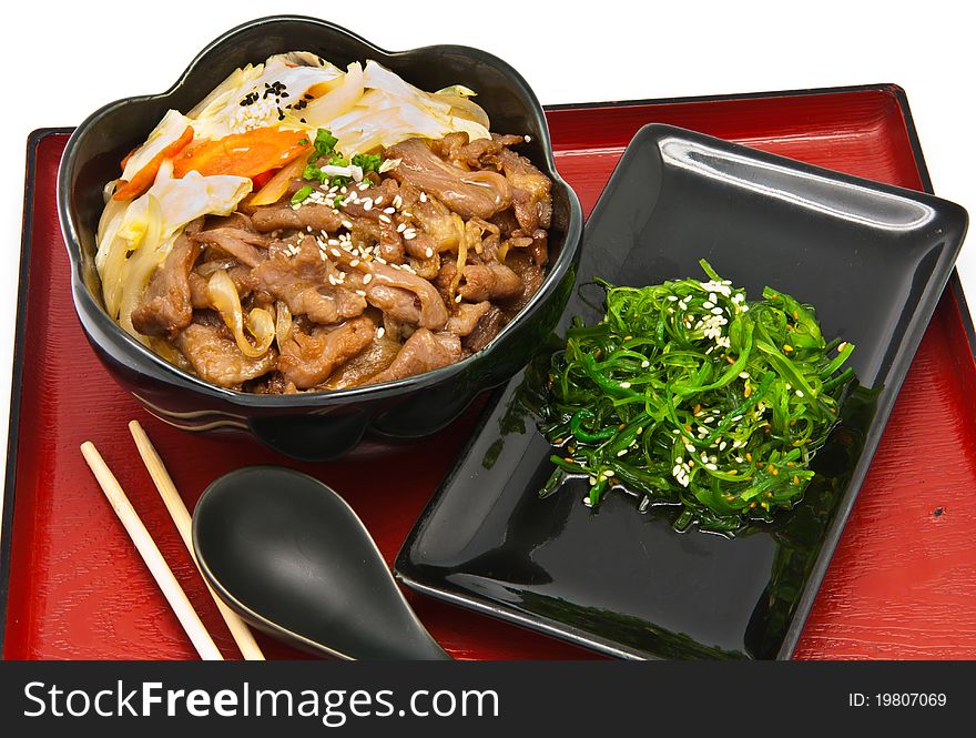 Rice with fried pork and seaweed Salad