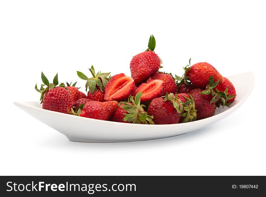 Strawberries in a dish on a white background