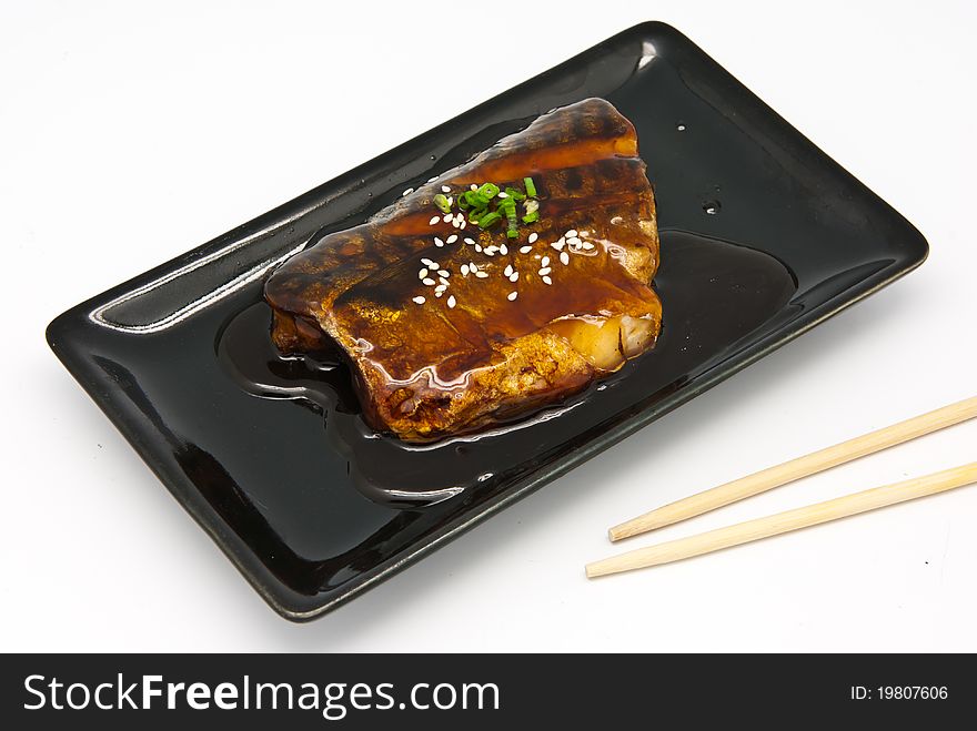 Japanese food style , Saba fish grilled with sauce in the plate on white background