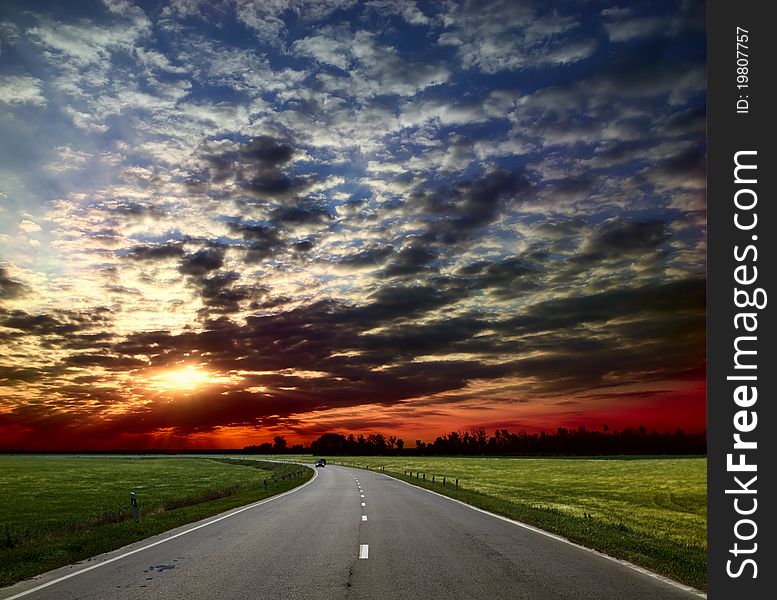 Asphalt road between the field. Asphalt road between the field