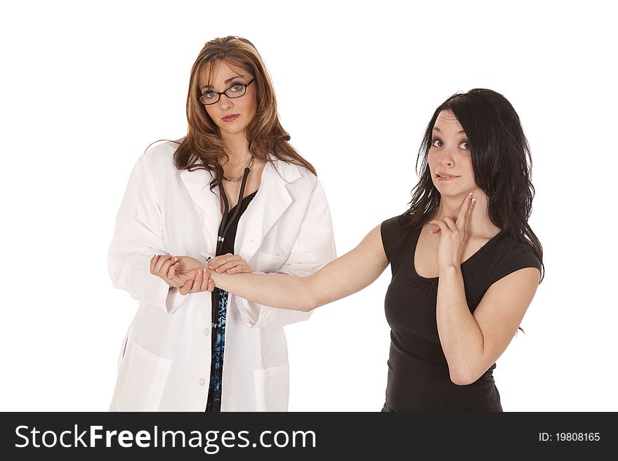 A women Doctor checking her patients pulse while her women patient is checking her own pulse. A women Doctor checking her patients pulse while her women patient is checking her own pulse.