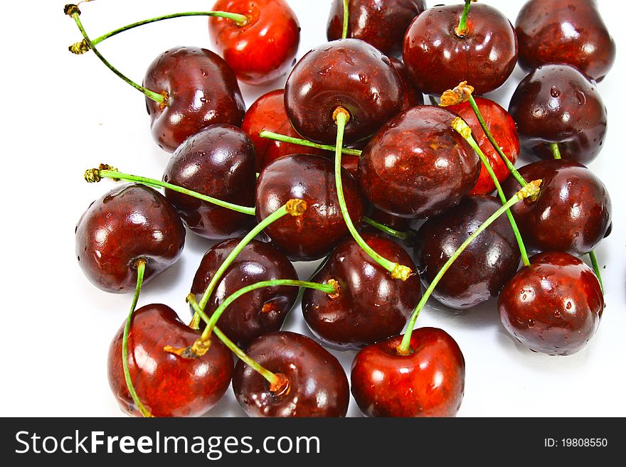 Ripe fresh cherries on a white background. Ripe fresh cherries on a white background