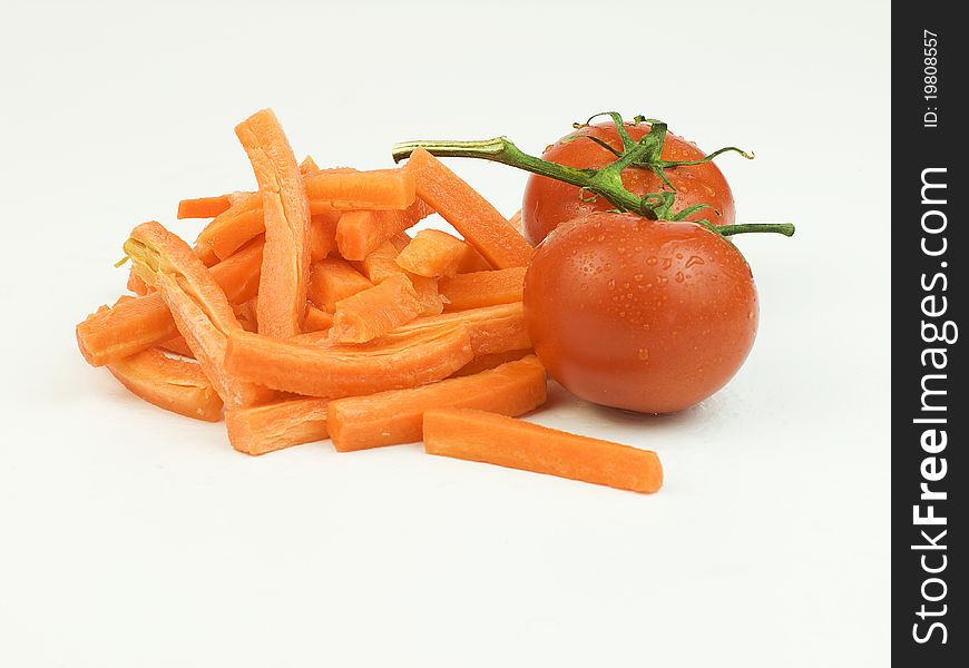 Organic sliced carrots and tomatoes. Organic sliced carrots and tomatoes
