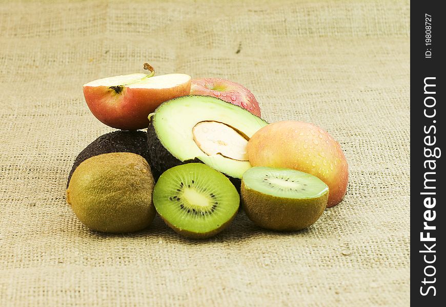 Organic sliced mixed fruit on dark background. Organic sliced mixed fruit on dark background