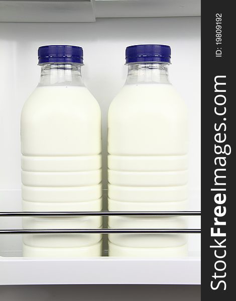 Bottles of fresh milk in the fridge