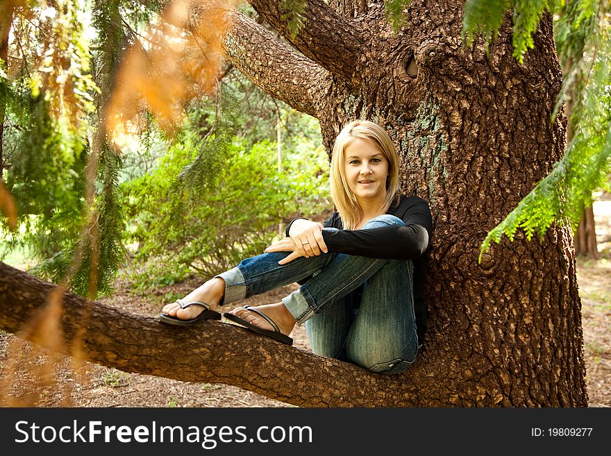 Portrait of smiling woman resting in the park