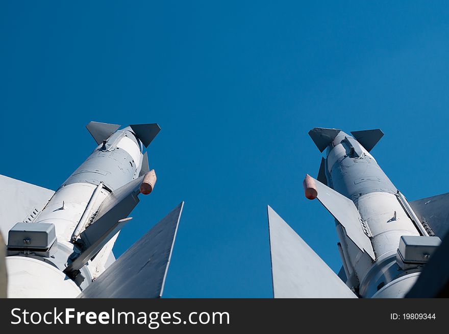 Two missiles against a background of blue sky