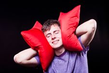 Man Sleeping Between Two Pillows Stock Photo