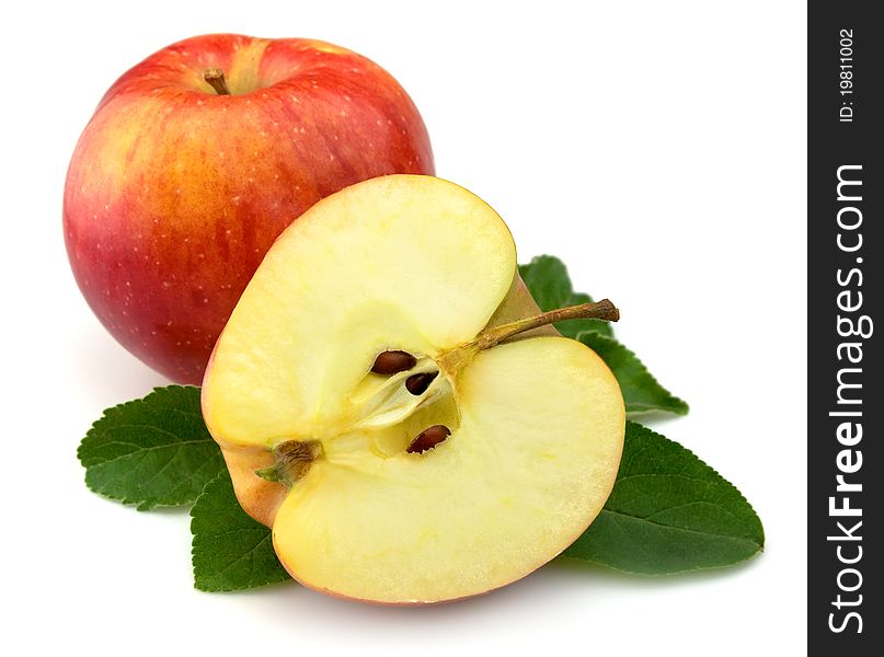 Juicy red apples with leaves on a white background