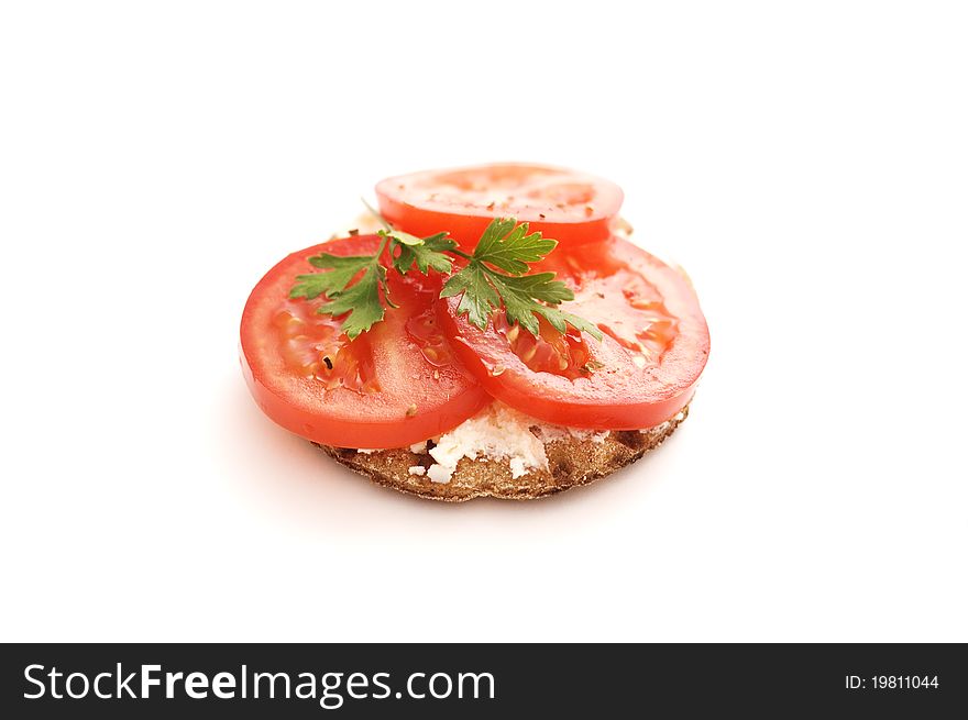 Crispbread and tomato isolated on white background