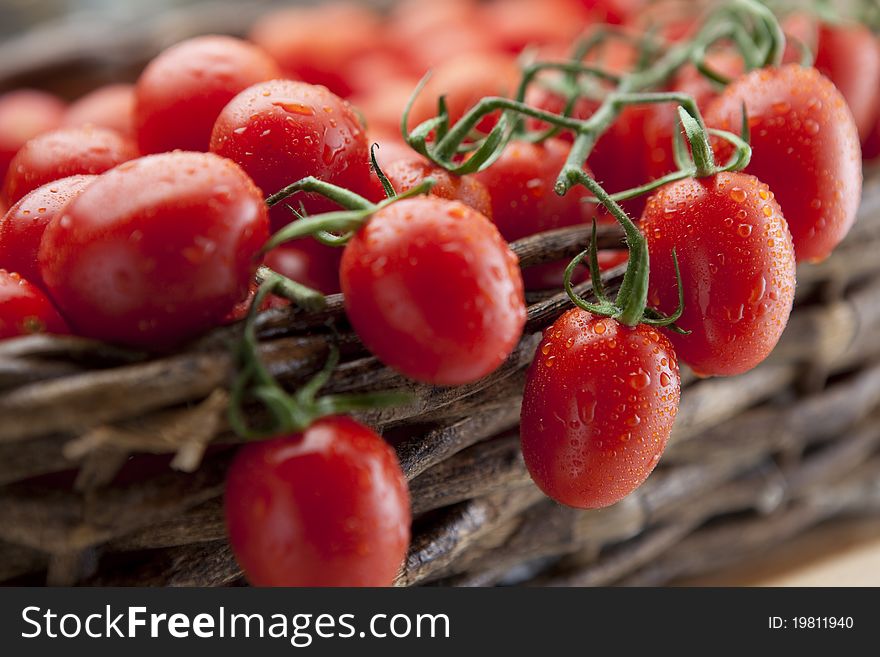 Ripe vine tomatoes arranged in a wicker basket